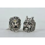 A Chinese white metal lion head ring and a dragon head ring
