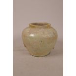 A Chinese Song dynasty (960-1279AD) earthenware pot with iridescent celadon glaze, 6" high