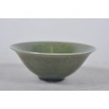 A Chinese olive green glazed shallow bowl, A/F, minuscule chip to rim, 3½" diameter