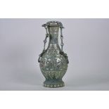 A Chinese mixed metal vase and cover with archaic style decoration and verdigris patination, 13½"