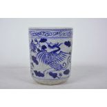 A Chinese blue and white porcelain brush pot decorated with a phoenix, 4½" high
