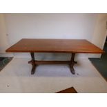 An oak refectory table on shaped end supports and stretcher, 79" x 39" wide
