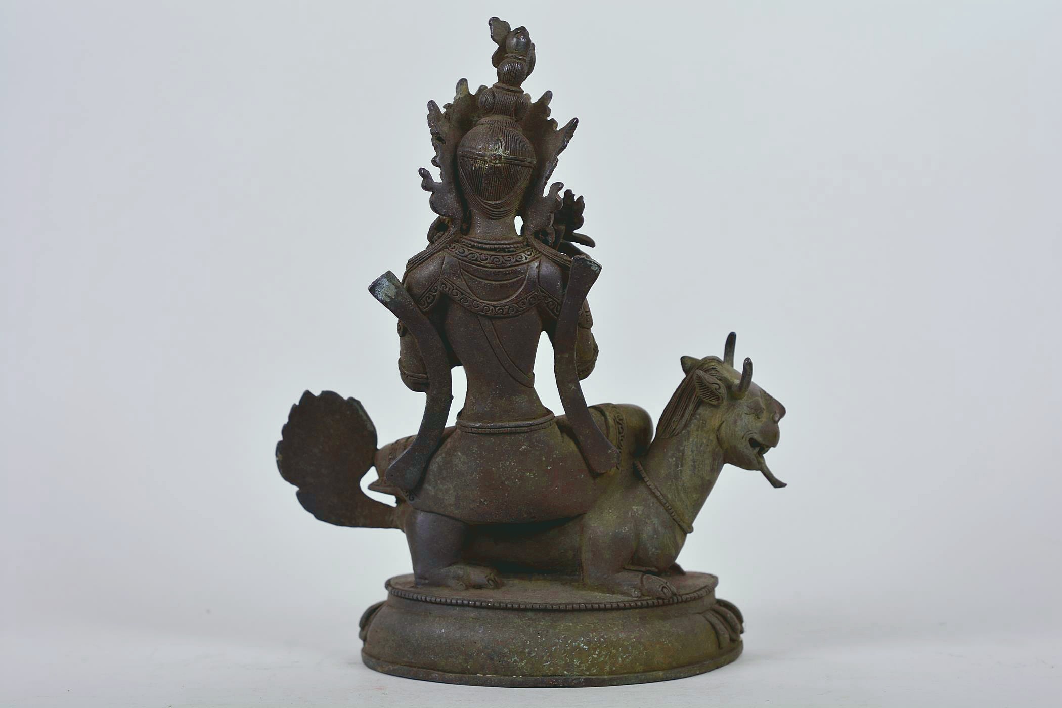 A Chinese patinated bronze figure of Buddha seated on a mythical beast, 10" high - Image 2 of 6