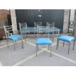 A bespoke steel conservatory table with glass top and six (four and two) matching chairs, 40" x 64"