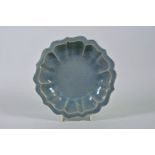 A Chinese celadon crackle glazed Ru ware style dish of lobed form, 7½" diameter
