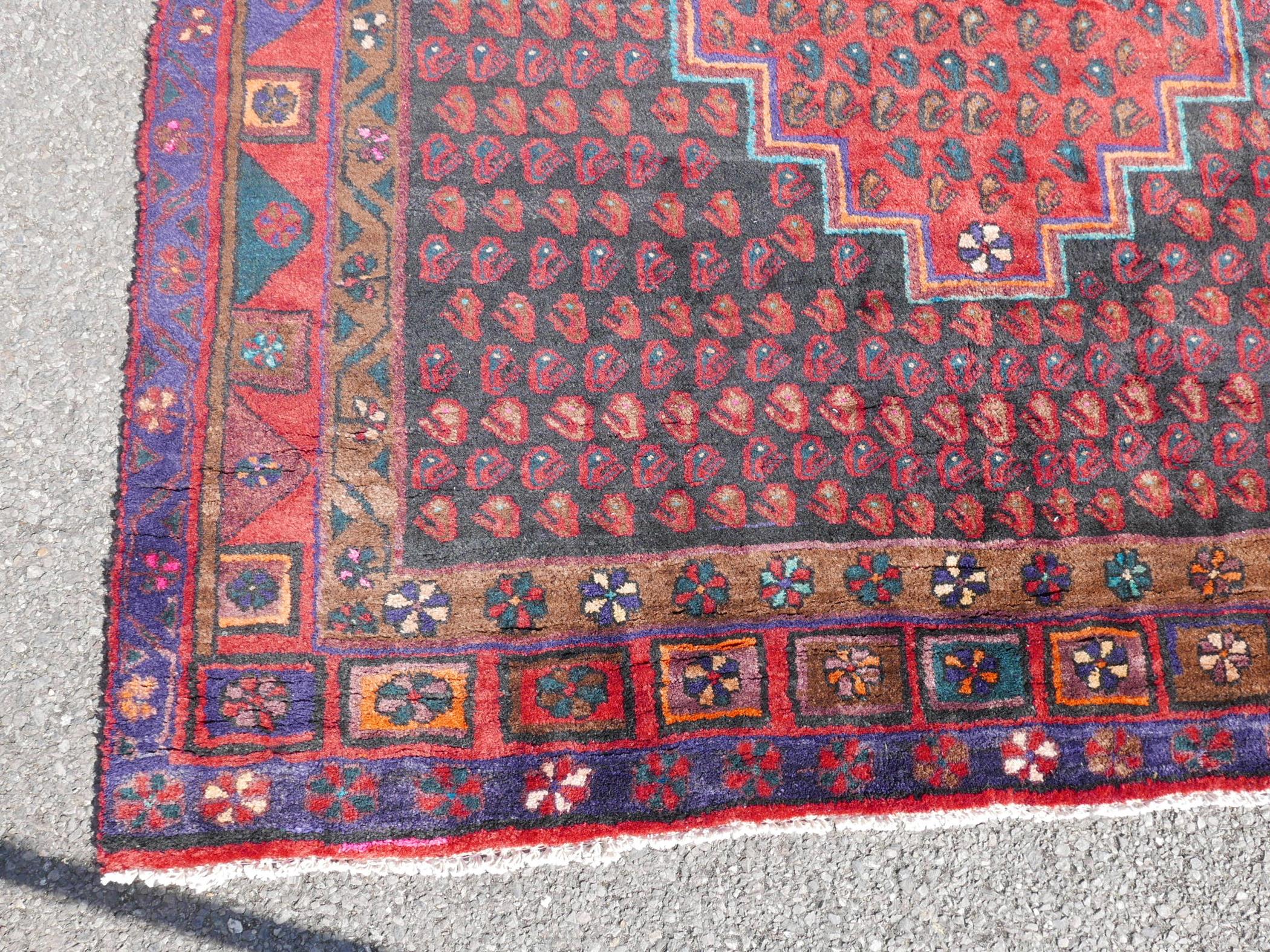 A Persian red ground Hamadan luri rug, 61" x 18" - Image 3 of 4