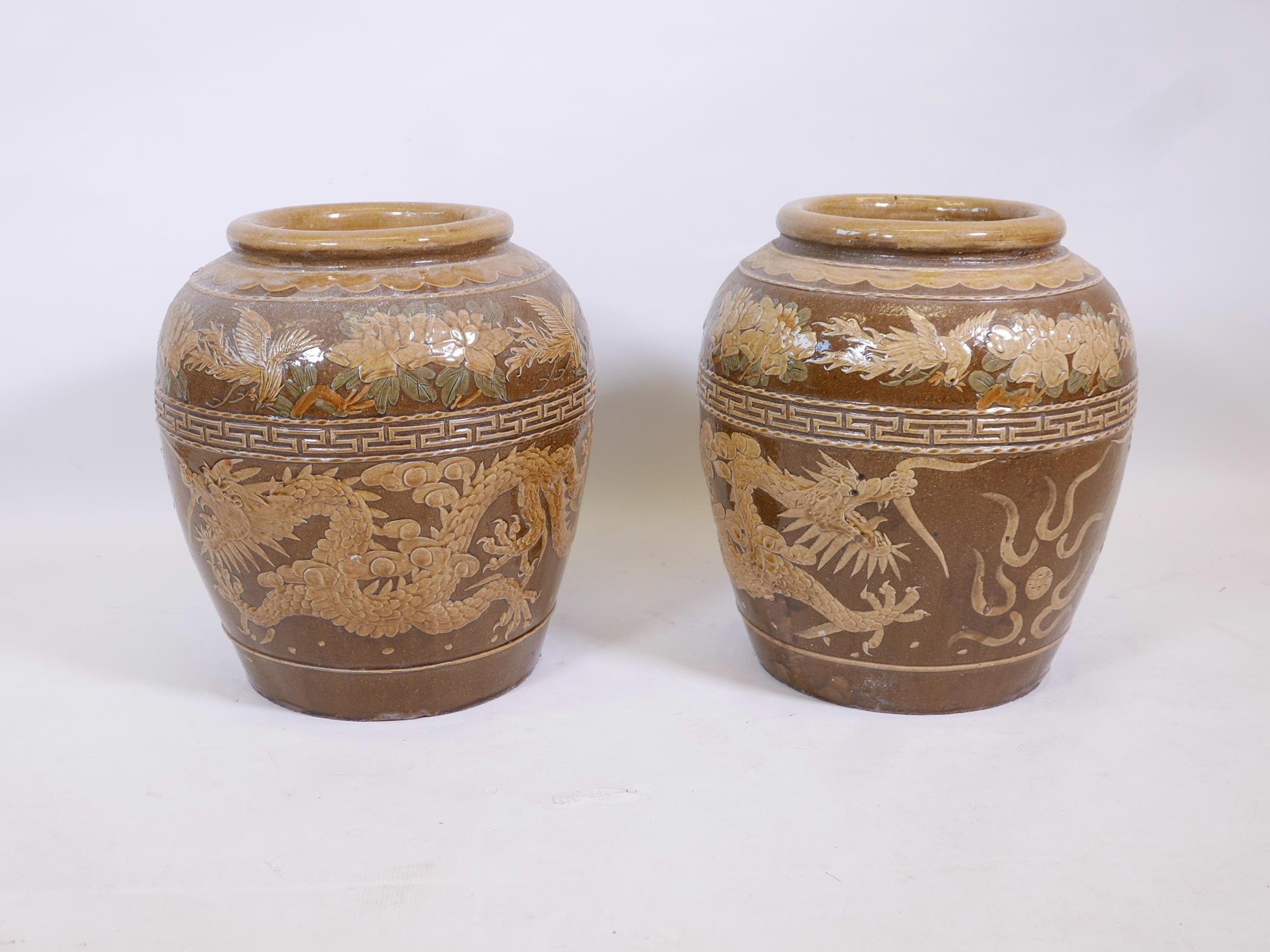 A pair of Chinese earthenware vases with raised dragon decoration, 18" high - Image 2 of 3