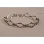 A Victorian style silver and marcasite set link bracelet