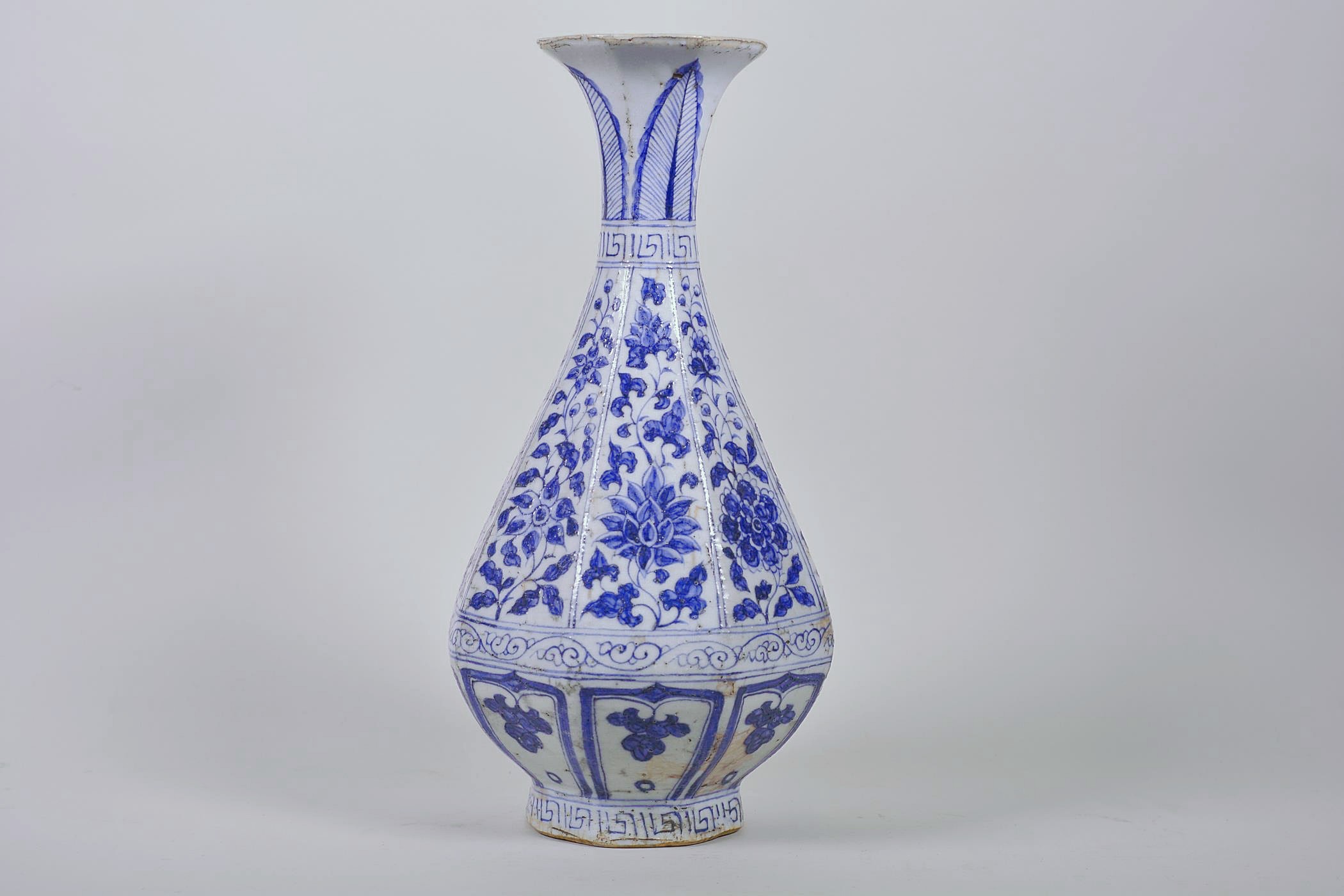 A Chinese Ming style blue and white pottery pear shaped vase decorated with flowers, 12" high