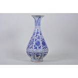 A Chinese Ming style blue and white pottery pear shaped vase decorated with flowers, 12" high