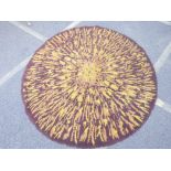 A mid century wool rug, with sunburst pattern, 72" diameter