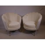 A pair of Art Deco style cream velvet clam shell chairs on brass feet, 33" high