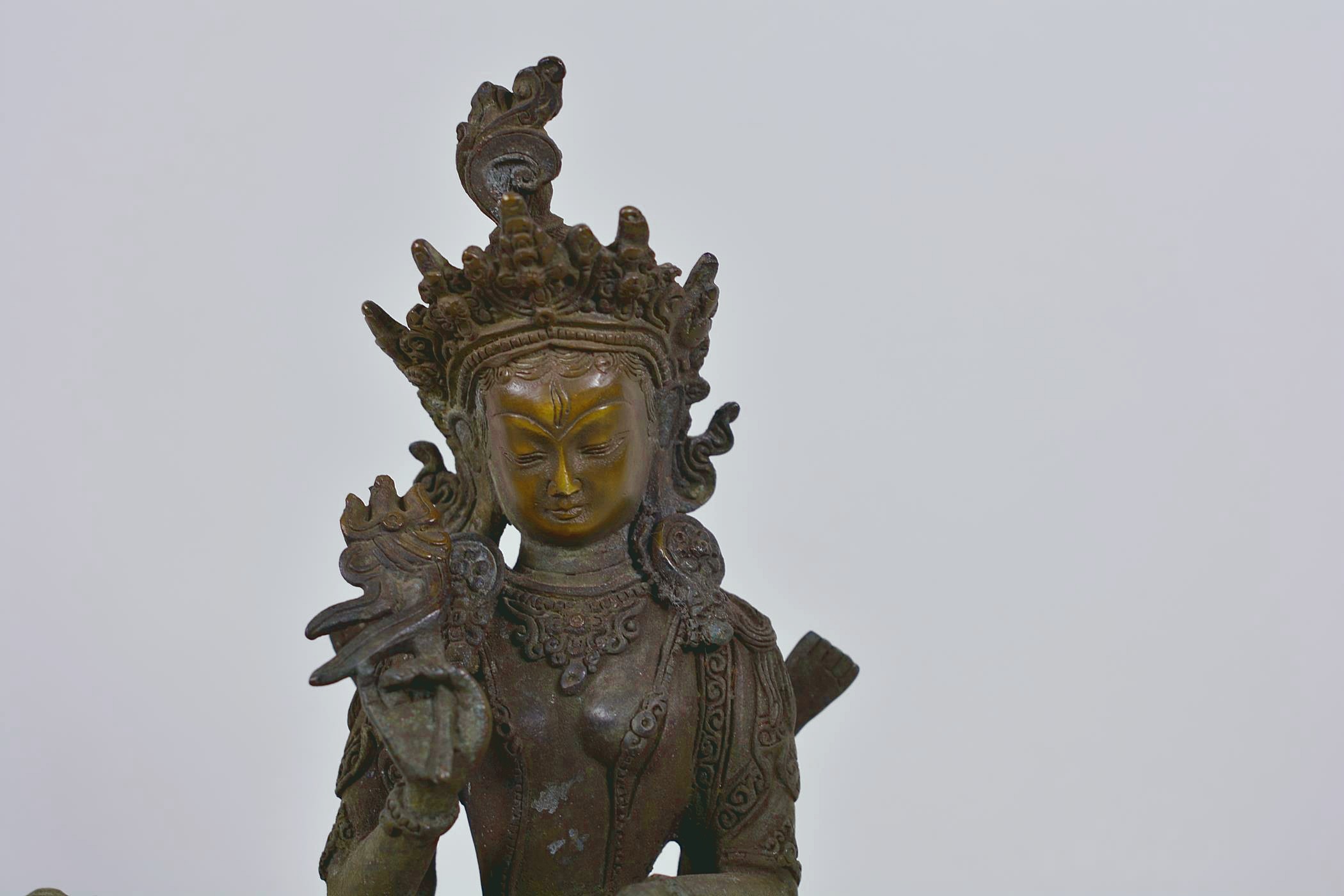 A Chinese patinated bronze figure of Buddha seated on a mythical beast, 10" high - Image 5 of 6