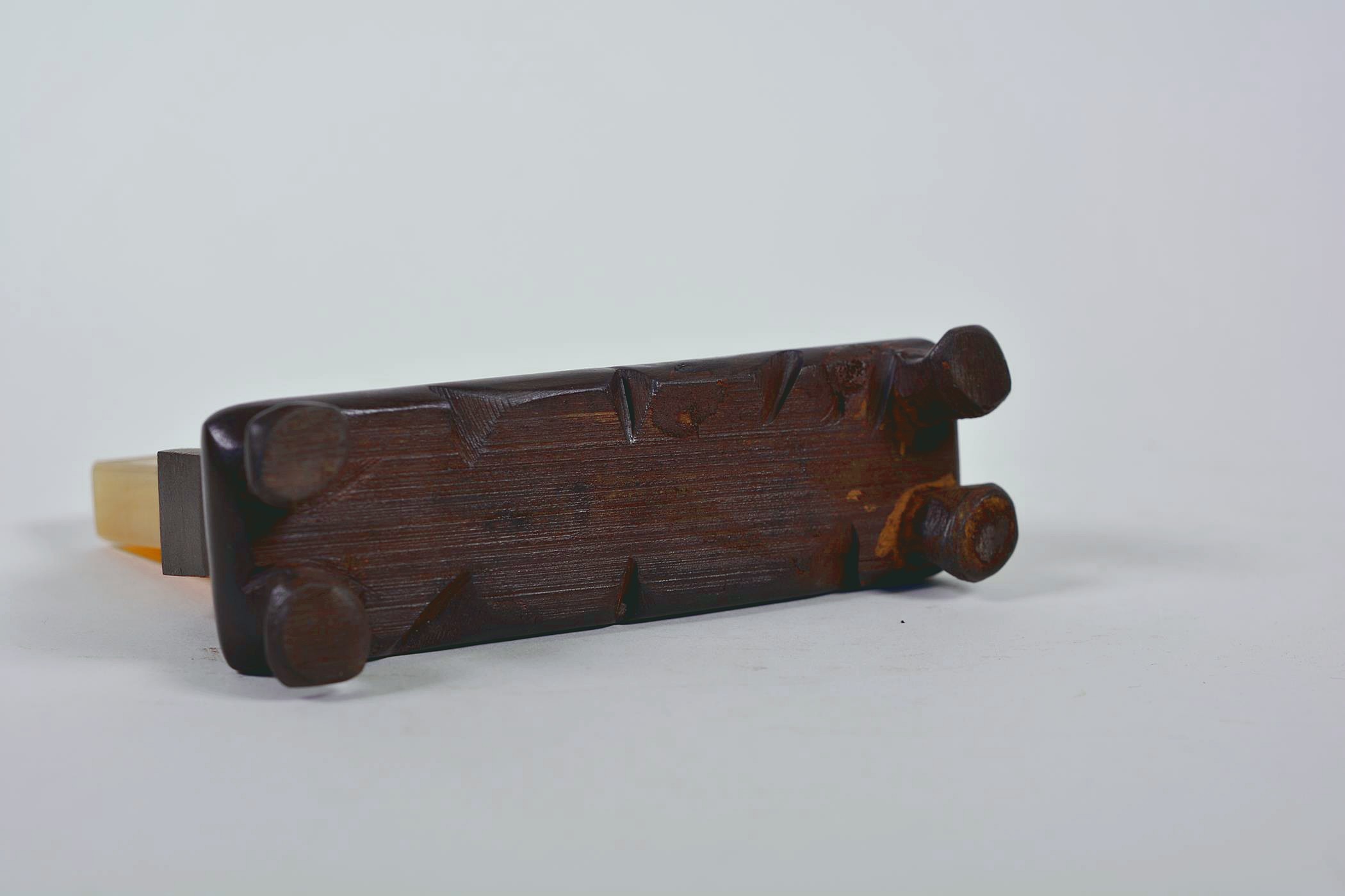 A Chinese amber soapstone tablet with character inscription decoration, mounted on a carved hardwood - Image 3 of 4