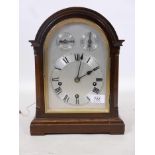 A mahogany cased eight day bracket clock the dial with Roman chapter ring and two subsidiary