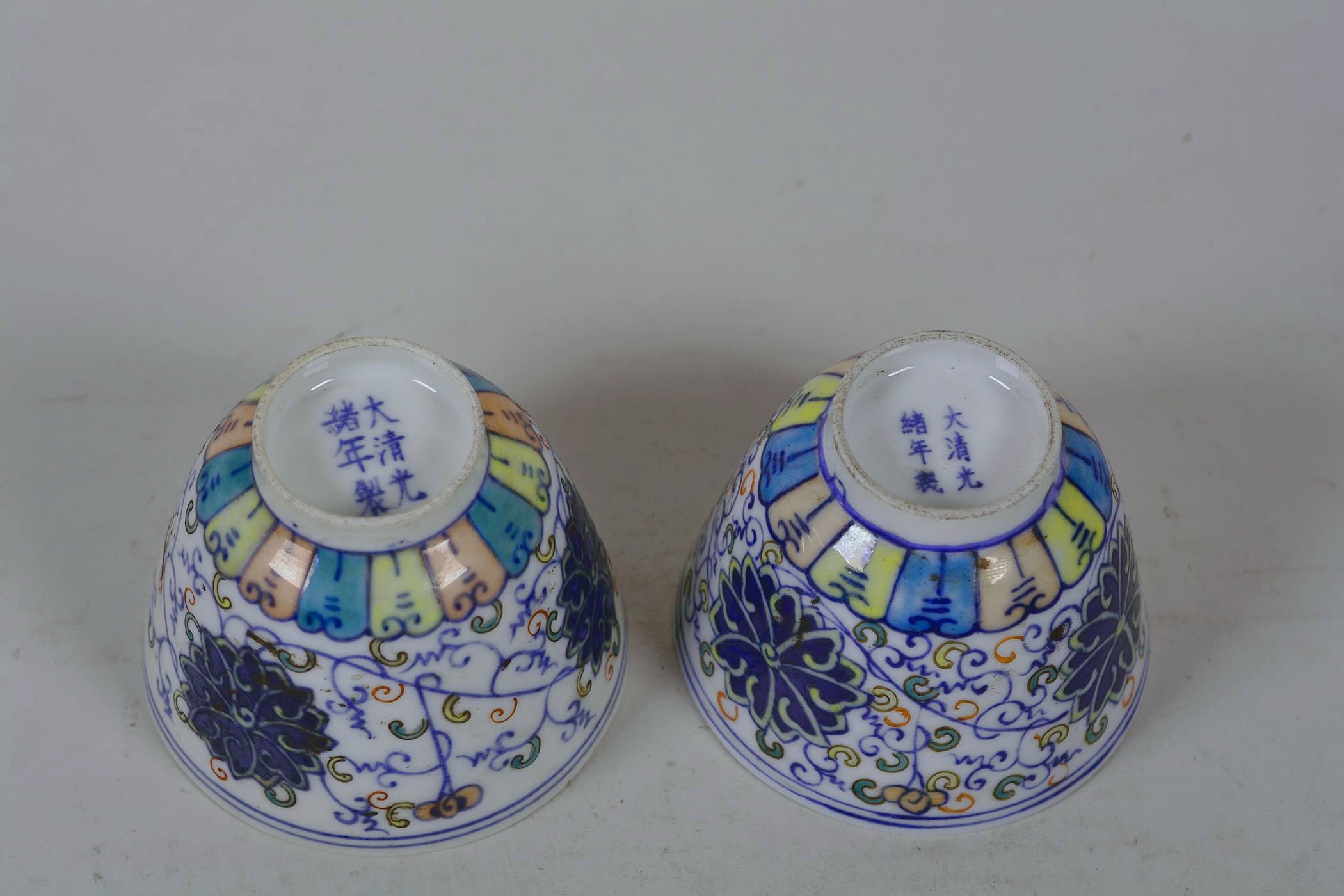 A pair of Chinese doucai porcelain tea bowls with lotus flower decoration, 6 character mark to base, - Image 3 of 4