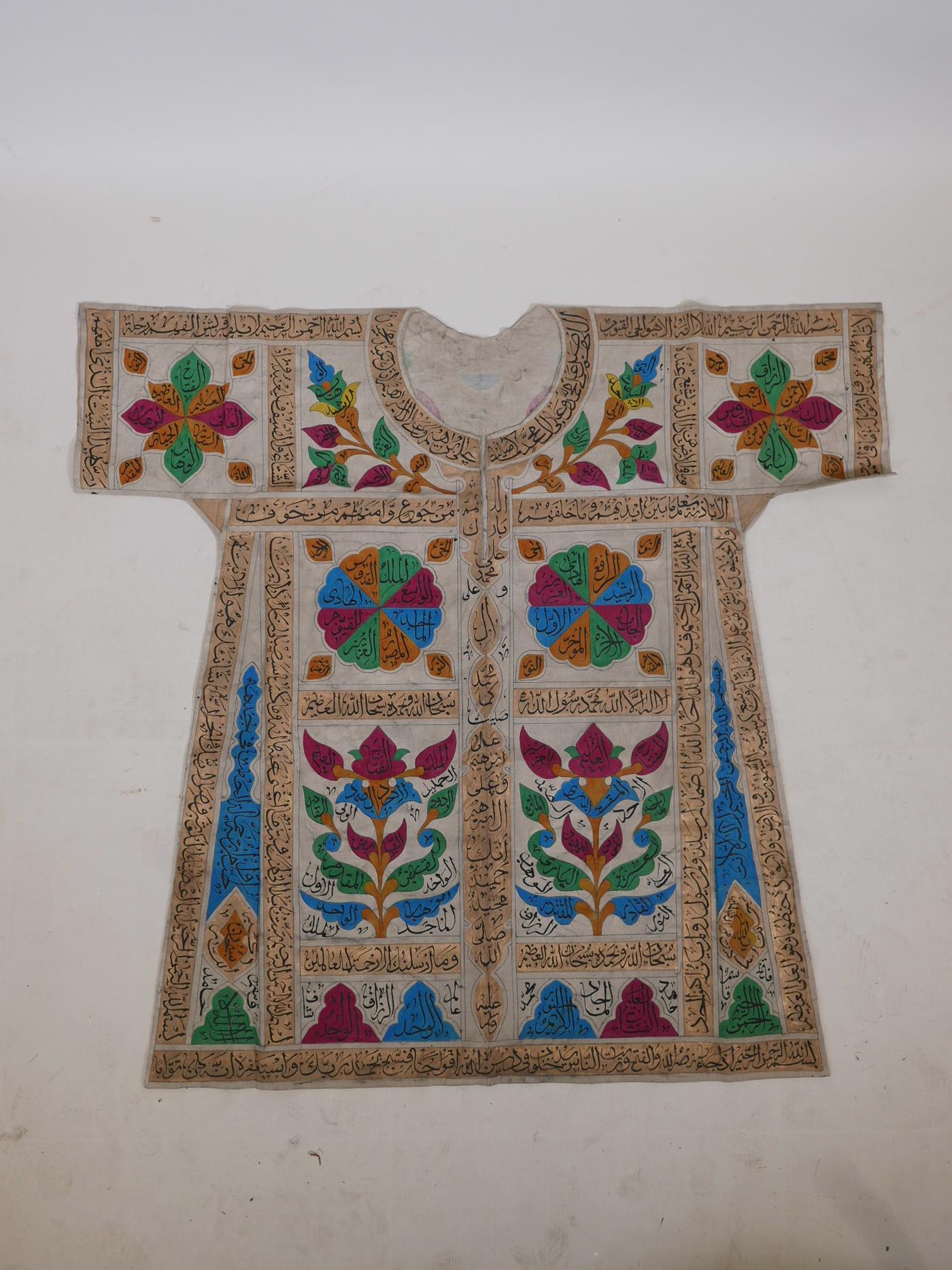 An Islamic linen tunic, decorated with polychrome patterns and all over calligraphy, 42" long