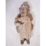 A C5th AD Mexican Nayarit painted terracotta tribal figure, numerous breaks (with faults), 19" x 9"