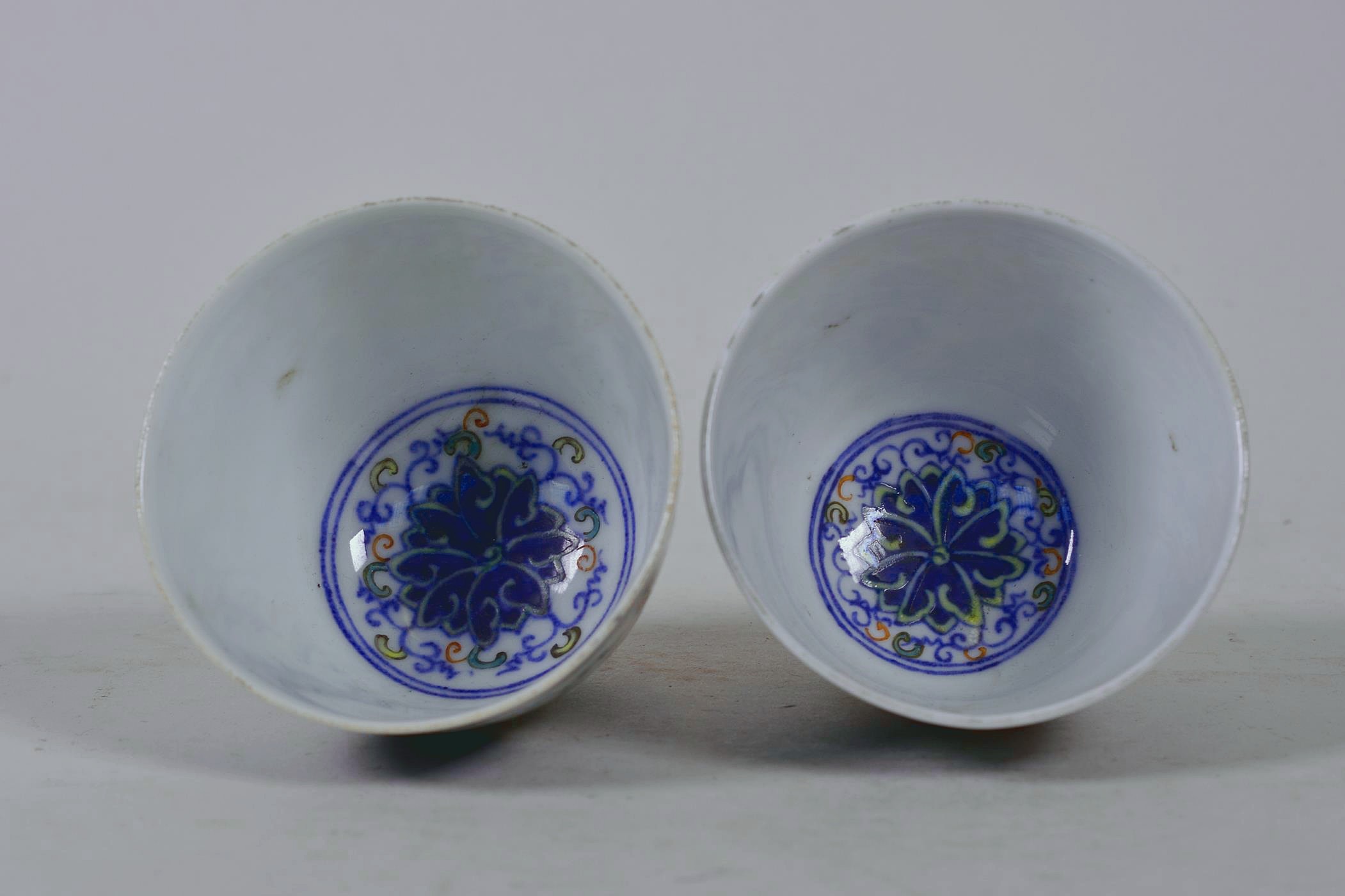 A pair of Chinese doucai porcelain tea bowls with lotus flower decoration, 6 character mark to base, - Image 4 of 4
