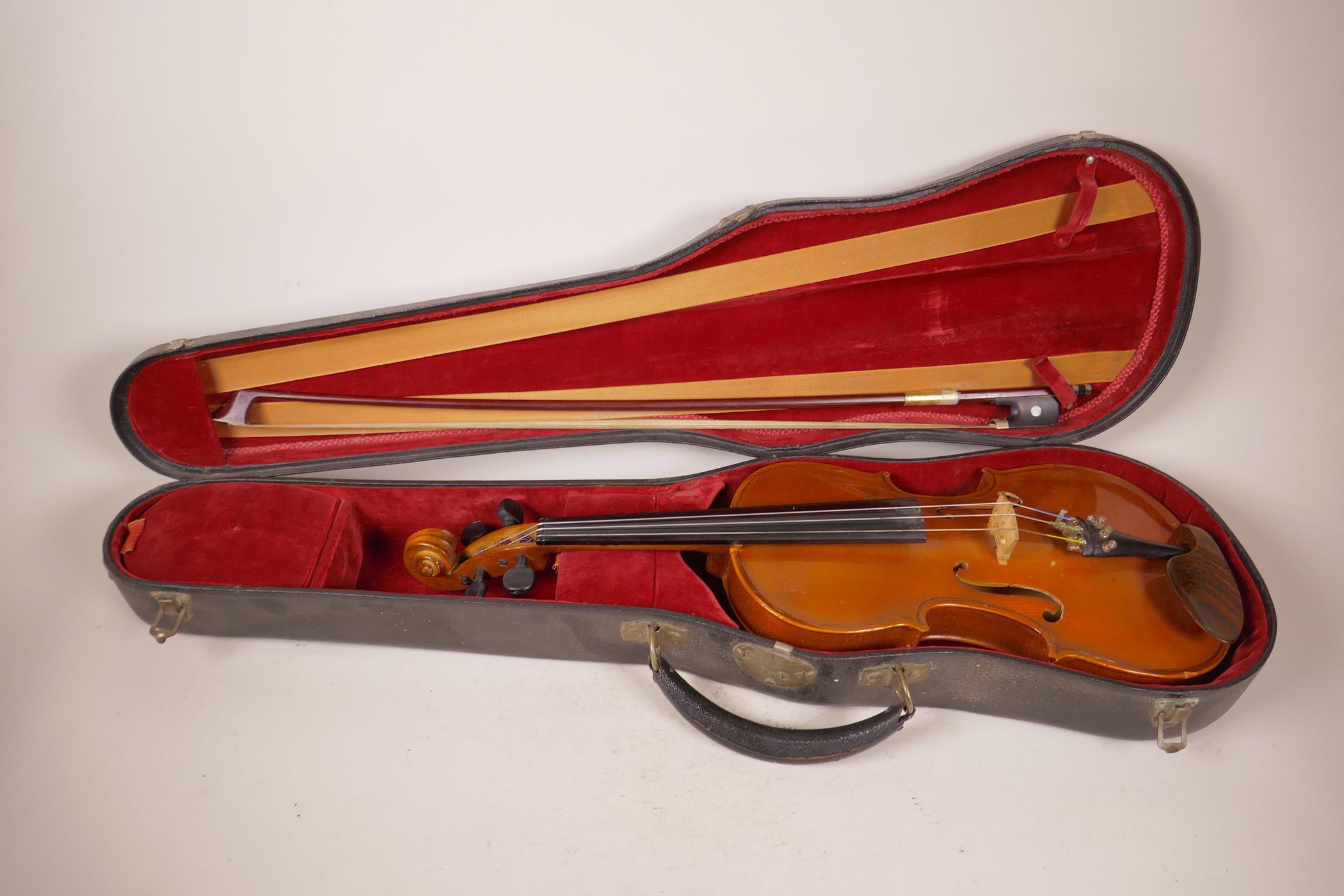 A small violin, 22½" long, with bow, in associated case