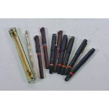 A collection of eight Rotring calligraphy pens together with an ink pen with glass handle filled