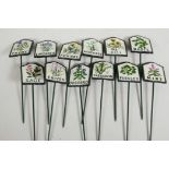 A set of twelve painted iron herb garden labels, 11½"