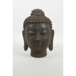 A cast iron Buddha head, 7½" high