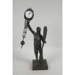 A bronzed metal mystery clock in the form of a pilot, 15" high