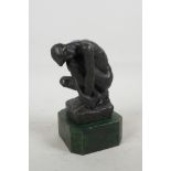 After Rodin, a bronze figure of The Thinker, mounted on a marbled plinth, 6½" high
