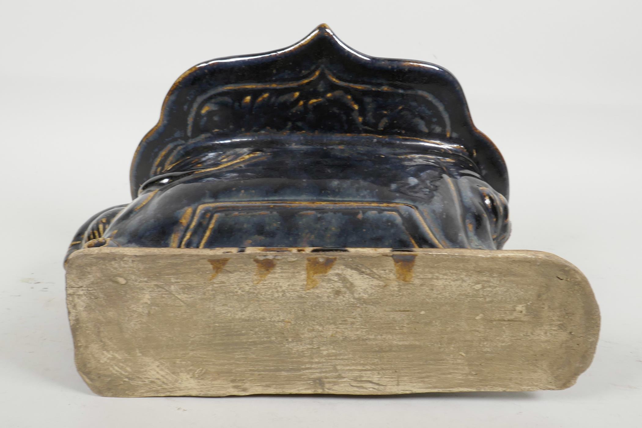 A Chinese Cizhou kiln pottery head rest moulded in the form of a reclining figure, with blue black - Image 4 of 4