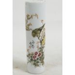 A Chinese porcelain scroll weight decorated with bird on a flowering branch in bright enamels, 6½"