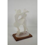 A frosted figurine of ballet dancers, on a wood plinth, 14" high