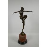 An Art Deco style bronze of a dancing girl, after J. Philipp, mounted on a marbled base, foundry