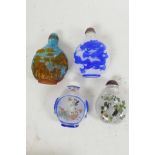 Four Peking glass snuff bottles, two with cased cut decoration, and two with interior decorated