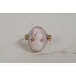 A hallmarked 9ct gold ring set with a shell cameo, size R/S