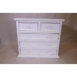 A painted hardwood chest of two over three drawers, with moulded front and metal drop handles, 39" x