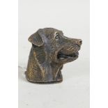 A brass vesta case in the form of a dog's head, 1½"