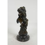 An Art Nouveau bronze head and shoulders bust of a girl, on a marble socle, 9½" high