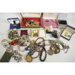 A quantity of costume jewellery including brooches, necklaces, earrings and bracelets