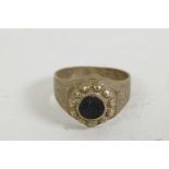 A rare Roman ring with dimple set carved stone and engraved shoulders