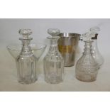 A pair of Victorian cut glass decanters, a decanter with hallmarked silver mount and another, a bowl