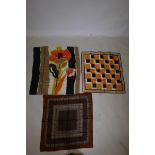 A collection of three vintage designer silk scarves including 'Jean Patou' and 'Pierre Cardin',