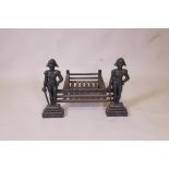 A cast iron fire grate with Napoleonic figure decoration, 19" x 22" x 15"