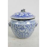 A C19th Chinese blue and white porcelain storage jar and cover with floral decoration and fo dog