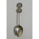 A Chinese silver teaspoon with auspicious character decoration, Chinese silver marks to the reverse,