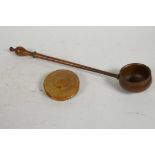 An antique hardwood ladle, 13½" long, and a treen patch box