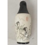 A Chinese bone snuff bottle decorated with figures in a garden scene, signed with seal mark, 3" long