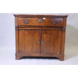 A C19th French mahogany chiffonier, with single drawer over two cupboards, raised on a shaped