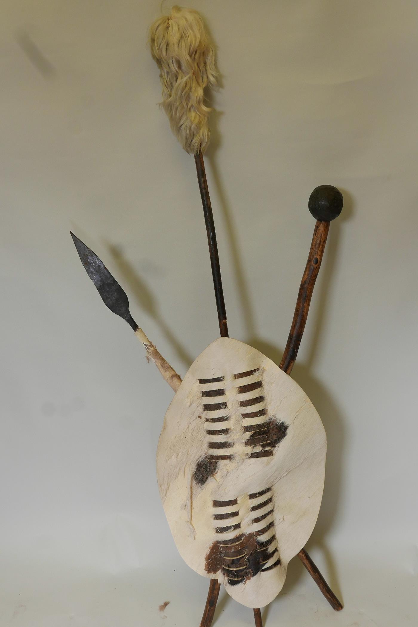 An African ceremonial display of leather shield with crossed club and spear, 7" long - Image 3 of 5