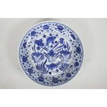 A Chinese blue and white porcelain charger decorated with carp in a lotus pond, 6 character mark